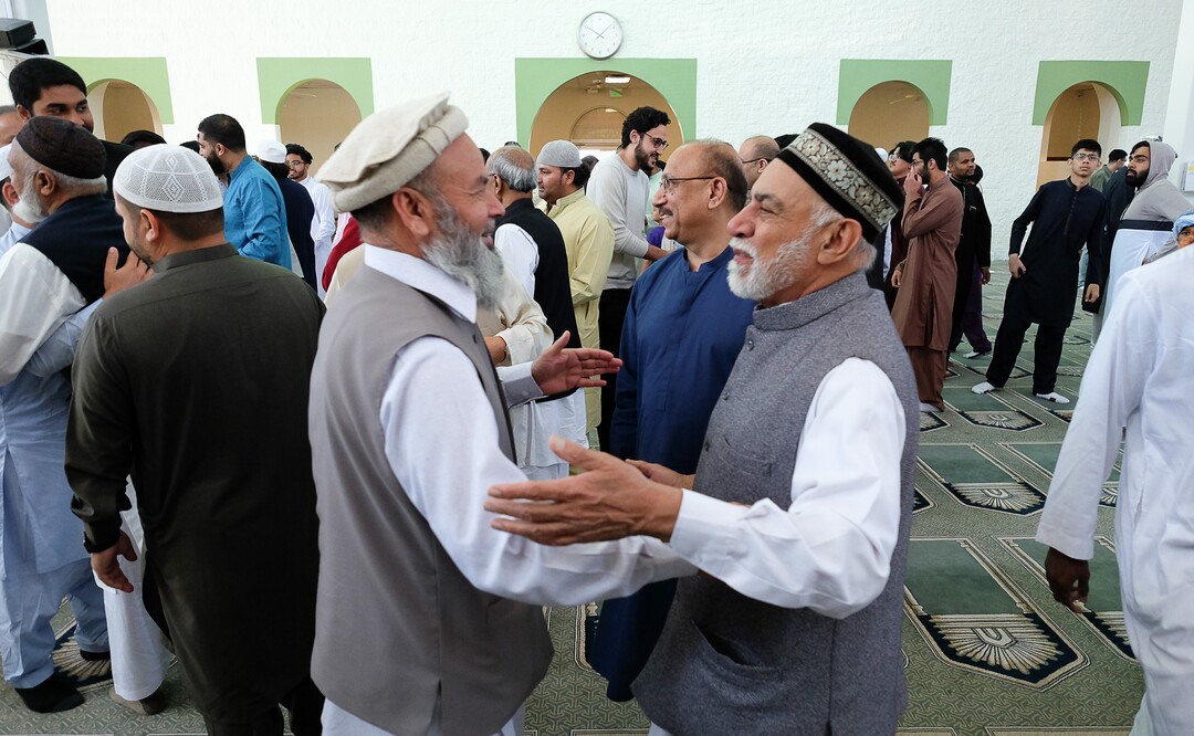 (Francisco Kjolseth  |  The Salt Lake Tribune)  Men of the Khadeeja Islamic Center in West Valley City exchange warm embraces with one another as they mark the end of Ramadan, a 30 day period of fasting and spiritual growth. It's the biggest religious holiday of the year for Muslims as hundreds from the Wasatch Front gather for the Eid the Òfestival of the breaking of the fast,Ó Wed. June 5, 2019.