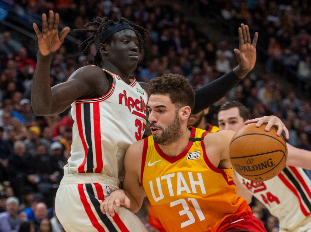 (Rick Egan  |  The Salt Lake Tribune)     Utah Jazz forward Georges Niang (31) takes the ball up the middle, as Portland Trail Blazers forward Wenyen Gabriel (35) defends, in NBA action between the Utah Jazz and the Portland Trail Blazers in Salt Lake City, Friday, Feb. 7, 2020.