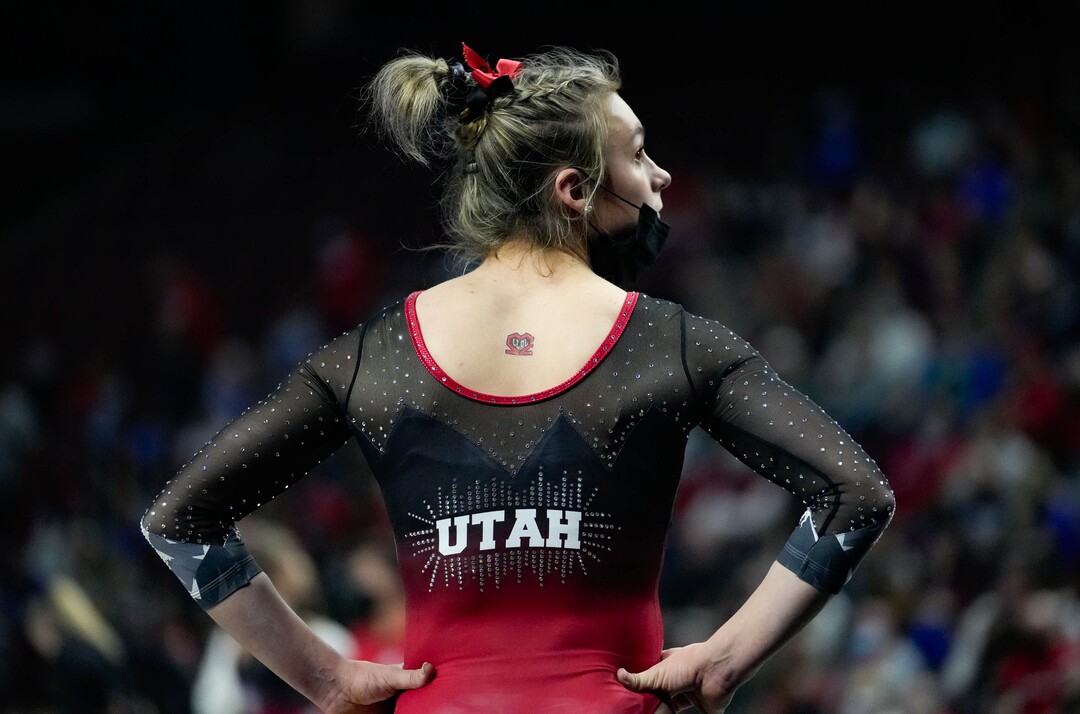 (Francisco Kjolseth | The Salt Lake Tribune) Utah’s Grace McCallum waits her turn on the floor as she honors the memory of football players Ty Jordan and Aaron Lowe along with the rest of the gymnastics team at the Best of Utah NCAA Gymnastics Meet at the Maverik Center in West Valley City on Friday, Jan. 7, 2022.