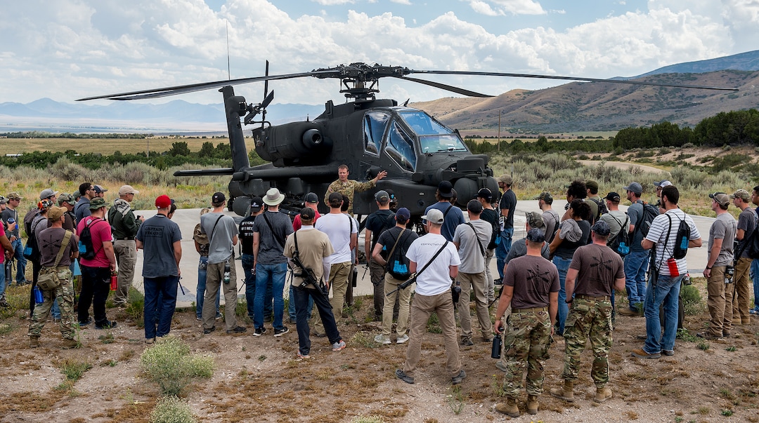 (Leah Hogsten  |  The Salt Lake Tribune) CW4 Stu Smith with the 1st Battalion of the 211th Aviation Regiment gives details about his training, what it's like to fly an Apache and details about the helicopter at the Utah National Guard Special Forces Survival Training Experience, August 10-12, 2017 at Camp Williams.