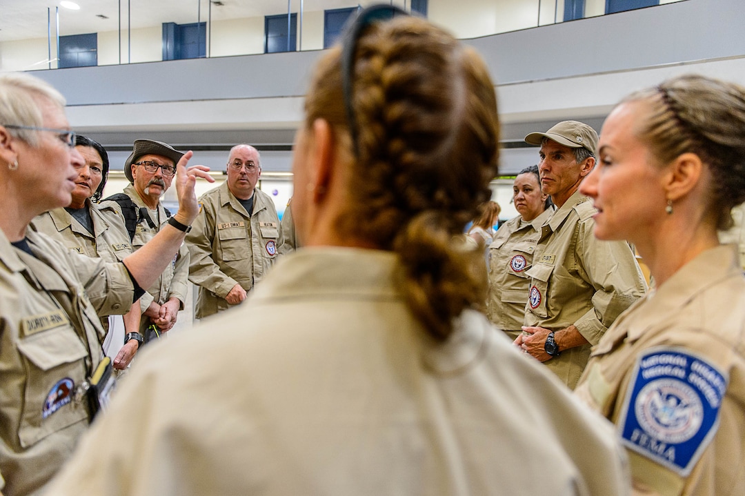 (Trent Nelson | The Salt Lake Tribune)  Commander Steven Bott, right, with his team as members of Utah's DMAT-1 (Disaster Medical Assistance Team) meet at the Salt Lake City Airport en route to Texas, Tuesday August 29, 2017. 36 members of the team are headed to the Houston area to help with the fallout of Hurricane Harvey.