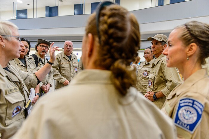 (Trent Nelson | The Salt Lake Tribune) Commander Steven Bott, right, with his team as members of Utah's DMAT-1 (Disaster Medical Assistance Team) meet at the Salt Lake City Airport en route to Texas, Tuesday August 29, 2017. 36 members of the team are headed to the Houston area to help with the fallout of Hurricane Harvey.
