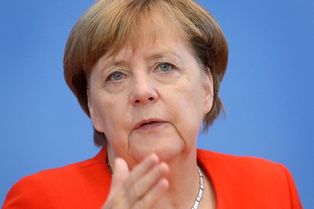 German Chancellor Angela Merkel gestures during her annual press conference at the Federal Press Conference in Berlin, Germany, Tuesday, Aug. 29, 2017. (AP Photo/Michael Sohn)