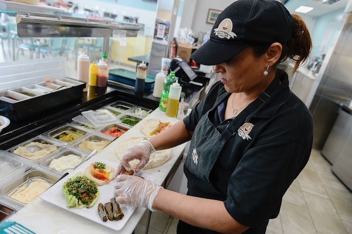 (Francisco Kjolseth  |  The Salt Lake Tribune)  Fatme Soweidan prepares an order at Beirut Cafe, a new Lebanese restaurant in Murray.