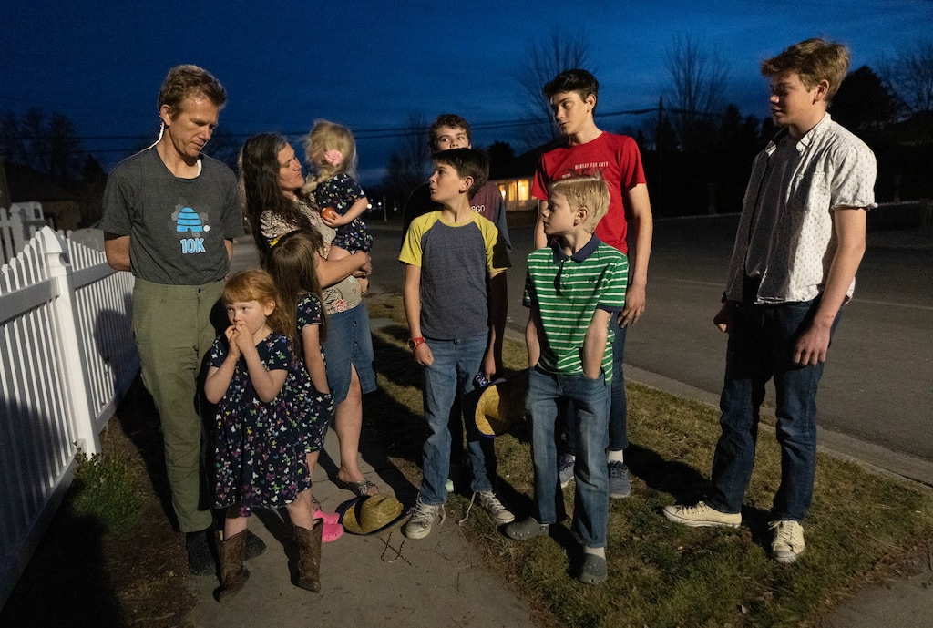 (Francisco Kjolseth | The Salt Lake Tribune) Sasha Pachev, left, who was born in Ukraine when it was part of the Soviet Union, is joined by his wife, Sarah, and some of their 11 children outside their home in Orem on Wednesday, March 2, 2022. They are part of a Russian-speaking Latter-day Saint branch in Salt Lake City, where Russians, Ukrainians and former East block immigrants.