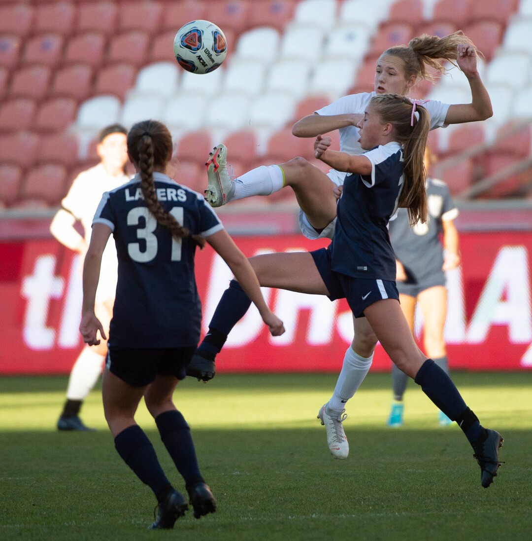 (Francisco Kjolseth  |  The Salt Lake Tribune) Kelly Bullock #10 of Olympus battles Ashlyn Price #13 of Bonneville as they compete in their 5A high school girls championship game at Rio Tinto Stadium in Sandy on Friday, Oct. 23, 2020. Bonneville went on to win 1-0 in overtime.