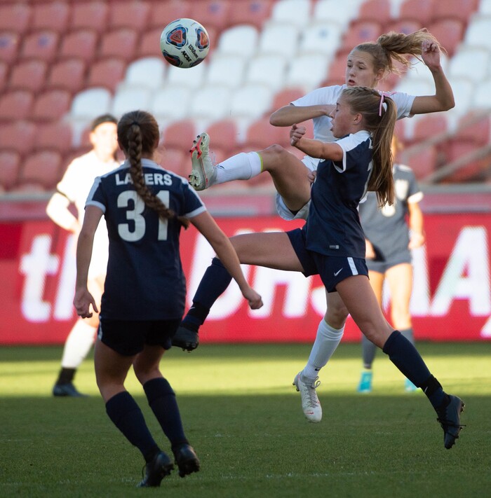 (Francisco Kjolseth  |  The Salt Lake Tribune) Kelly Bullock #10 of Olympus battles Ashlyn Price #13 of Bonneville as they compete in their 5A high school girls championship game at Rio Tinto Stadium in Sandy on Friday, Oct. 23, 2020. Bonneville went on to win 1-0 in overtime.