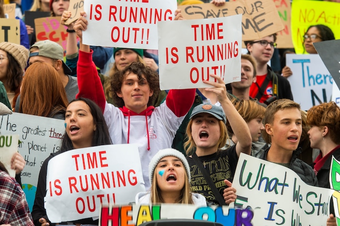 (Rick Egan  |  The Salt Lake Tribune)      Hundreds of students from around the state chant and sing as they gather on the steps of the Utah State Capitol Building, demanding action on the climate crisis. Friday, Sept. 20, 2019.