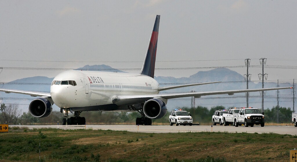 (Scott Sommerdorf  |  Tribune File Photo)  Delta's first flight from Paris is escorted by police vehicles after it touched down at Salt Lake International Airport, Monday June 2, 2008.