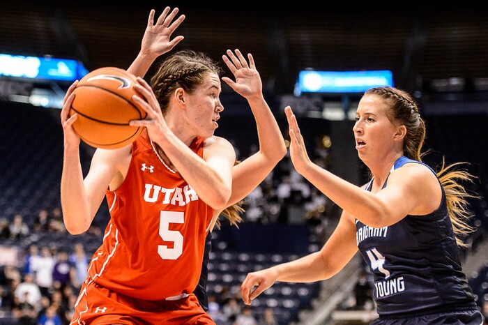 (Trent Nelson | The Salt Lake Tribune)  Utah Utes center Megan Huff (5) and Brigham Young Cougars forward Amanda Wayment (4) as BYU hosts Utah, NCAA women's basketball in Provo, Saturday December 9, 2017.