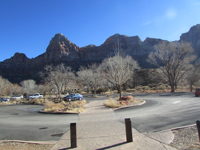 (Tom Wharton | The Salt Lake Tribune) A mostly empty parking lot at the Zion National Park visitor center is a rare site, but with the visitor center and restrooms closed, there was little reason to visit except to look at outdoor exhibits or pick up a park newspaper. Park services have been reduced because of a federal government shutdown that went into effect at midnight Friday after the Senate was unable to pass a new spending bill.