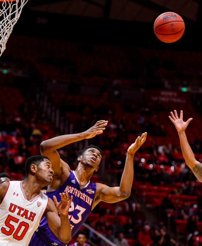 (Trent Nelson | The Salt Lake Tribune)  Utah Utes guard Christian Popoola (50) and Northwestern State Demons forward Darian Dixon (23) as the University of Utah hosts Northwestern State, NCAA basketball in Salt Lake City, Wednesday December 20, 2017.