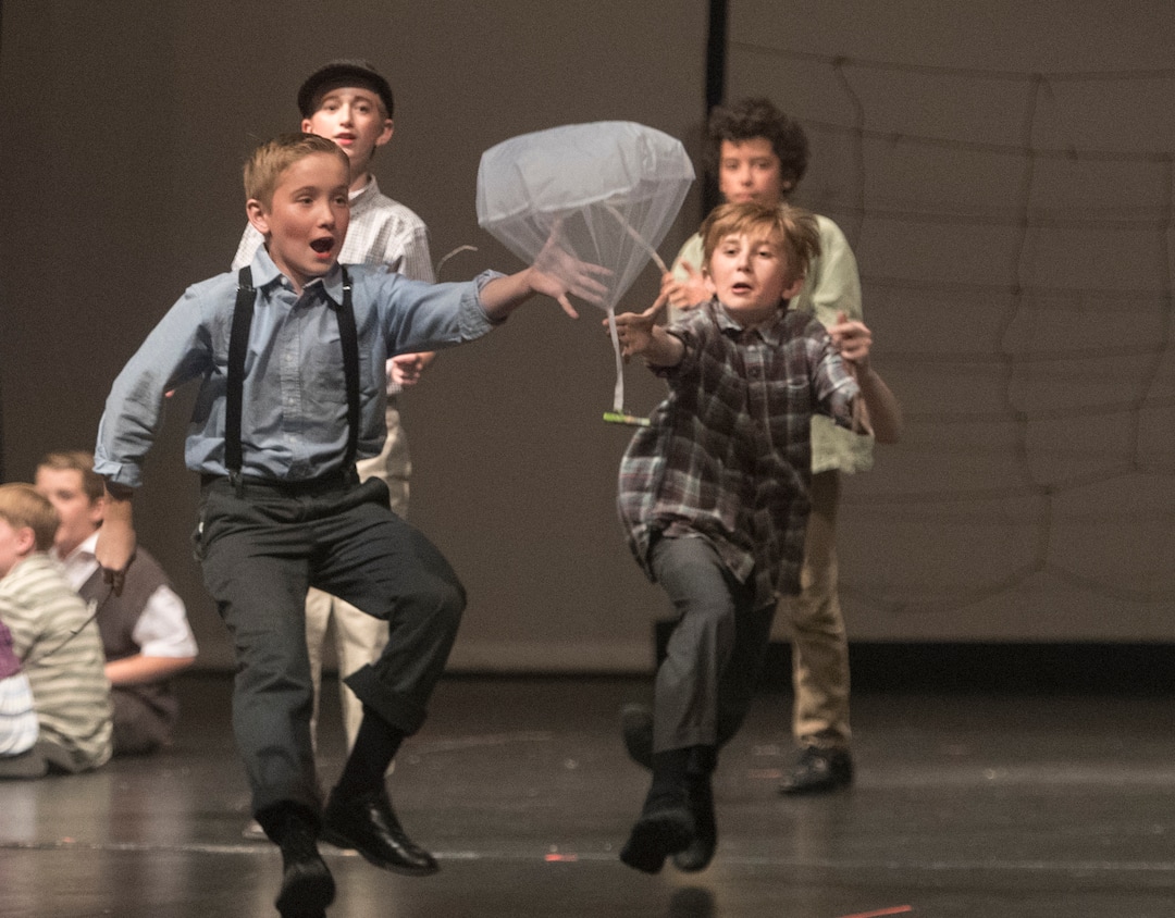 (Rick Egan  |  The Salt Lake Tribune) Mueller Park Jr High students playing children from West Berlin, chase handkerchiefs with candy bars attached in the Mueller Park Jr High production of "The Berlin Candy Bomber" at Woods Cross High School, Saturday, November 11, 2017.
