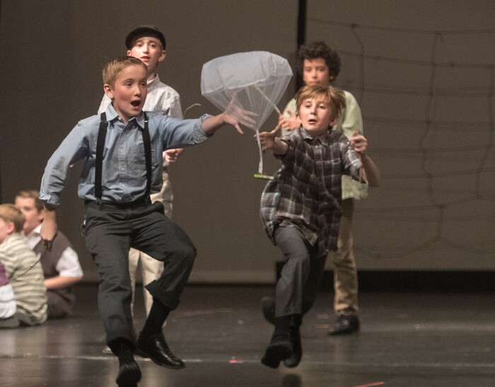 (Rick Egan | The Salt Lake Tribune) Mueller Park Jr High students playing children from West Berlin, chase handkerchiefs with candy bars attached in the Mueller Park Jr High production of "The Berlin Candy Bomber" at Woods Cross High School, Saturday, November 11, 2017.