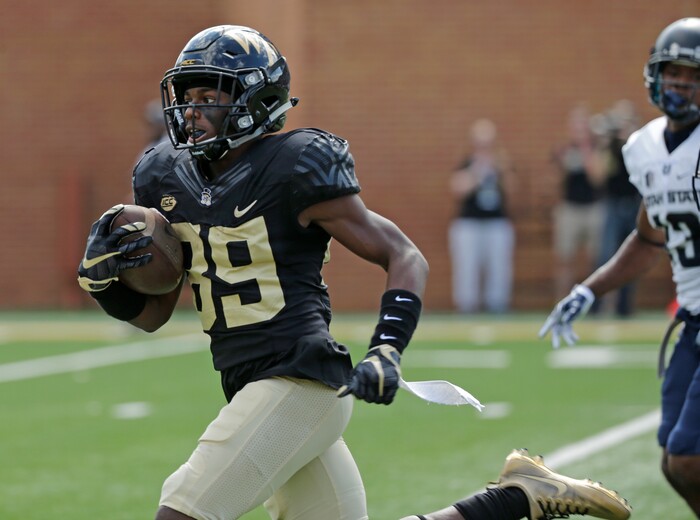 Wake Forest's Greg Dortch (89) runs for a touchdown after a catch against Utah State in the first half of an NCAA college football game in Winston-Salem, N.C., Saturday, Sept. 16, 2017. (AP Photo/Chuck Burton)