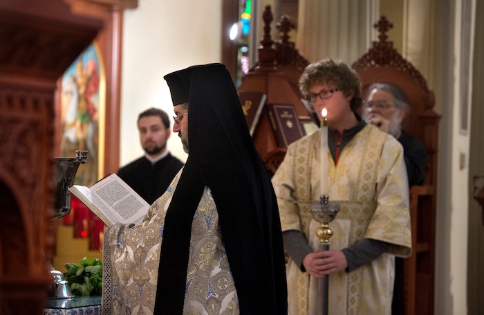 (Scott Sommerdorf | The Salt Lake Tribune)
The Very Rev. Archimandrite George Nikas leads the Epiphany service (also called Theophany in Orthodox), at Holy Trinity Cathedral, Saturday, January 6, 2018.