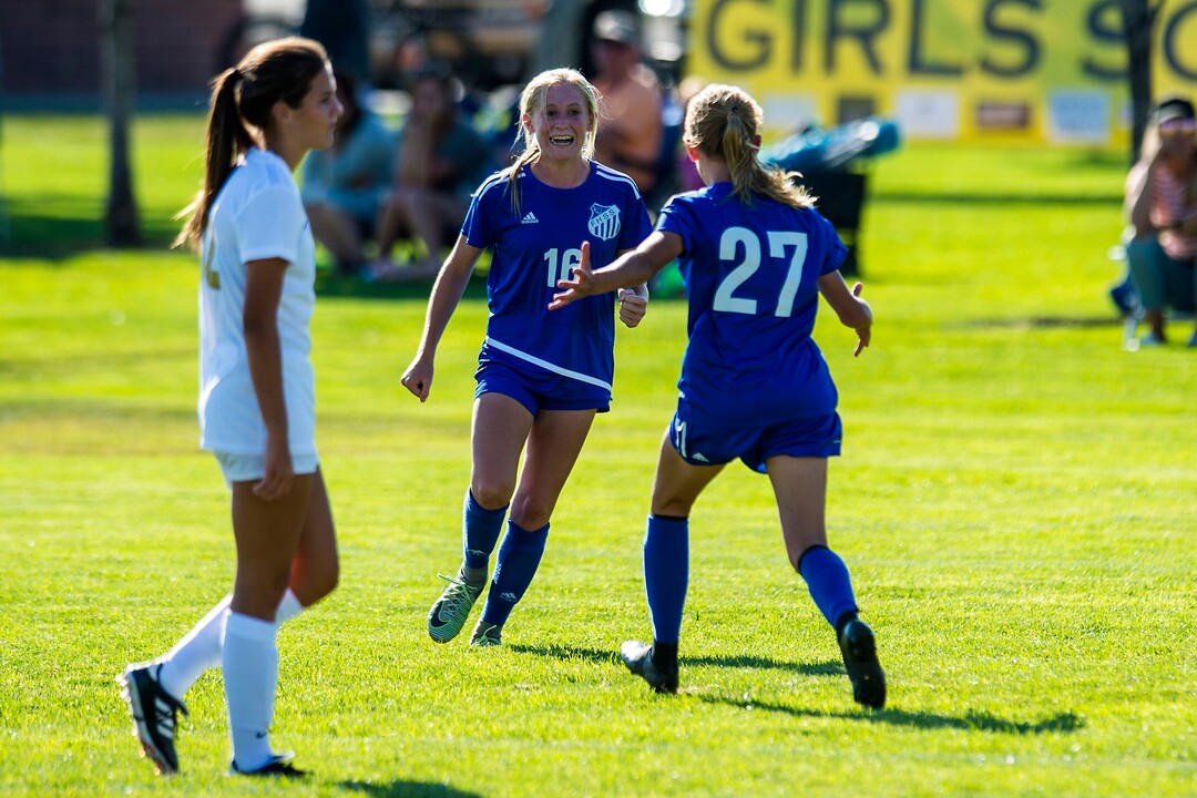(Chris Detrick  |  The Salt Lake Tribune)  Fremont's Brynlee Meyerhofer (16) and Fremont's Abbi Sanford (27) celebrate after winning the game at Angel Street Soccer Complex in Kaysville Thursday, August 24, 2017. Fremont defeated Davis 5-4 in double overtime.
