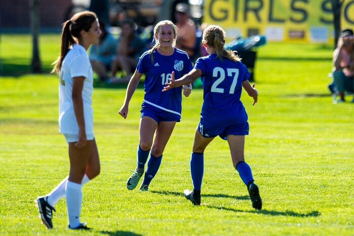(Chris Detrick | The Salt Lake Tribune) Fremont's Brynlee Meyerhofer (16) and Fremont's Abbi Sanford (27) celebrate after winning the game at Angel Street Soccer Complex in Kaysville Thursday, August 24, 2017. Fremont defeated Davis 5-4 in double overtime.