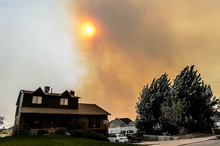 (Trent Nelson | The Salt Lake Tribune)  Smoke fills the sky over South Weber as a fire burns at the mouth of Weber Canyon, Tuesday September 5, 2017.