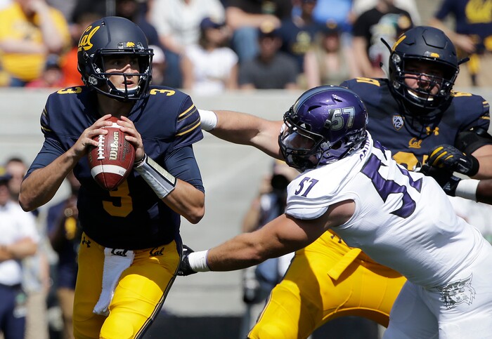 California quarterback Ross Bowers (3) looks to pass as he is pressured by Weber State defensive lineman Jared Schiess (57) during the first half of an NCAA college football game in Berkeley, Calif., Saturday, Sept. 9, 2017. (AP Photo/Jeff Chiu)