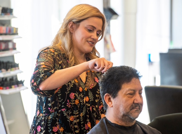 (Rick Egan  |  The Salt Lake Tribune)     Alyssa Brown styles Edward Santillanes hair at Mid City Salon, Saturday, March 21, 2020.