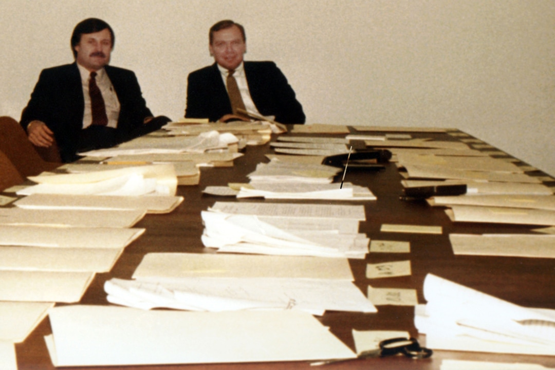 (photo courtesy Huntsman family) Jon Huntsman sits at a table covered in documents before closing on a deal to buy a polystyrene plant from Shell Chemical in 1983.