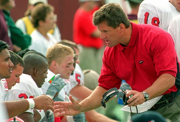 (Rick Egan | The Salt Lake Tribune) Kyle Whittingham talks to his defensive players on the sidelines of the Utah  - Washington State football game in 1999.