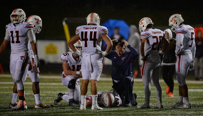 (Francisco Kjolseth  |  The Salt Lake Tribune)  Timpview's  Chandler Sorenson is eventually taken off the field after being injured in the third quarter against Corner Canyon in game action on Thursday, Sept. 21, 2017.