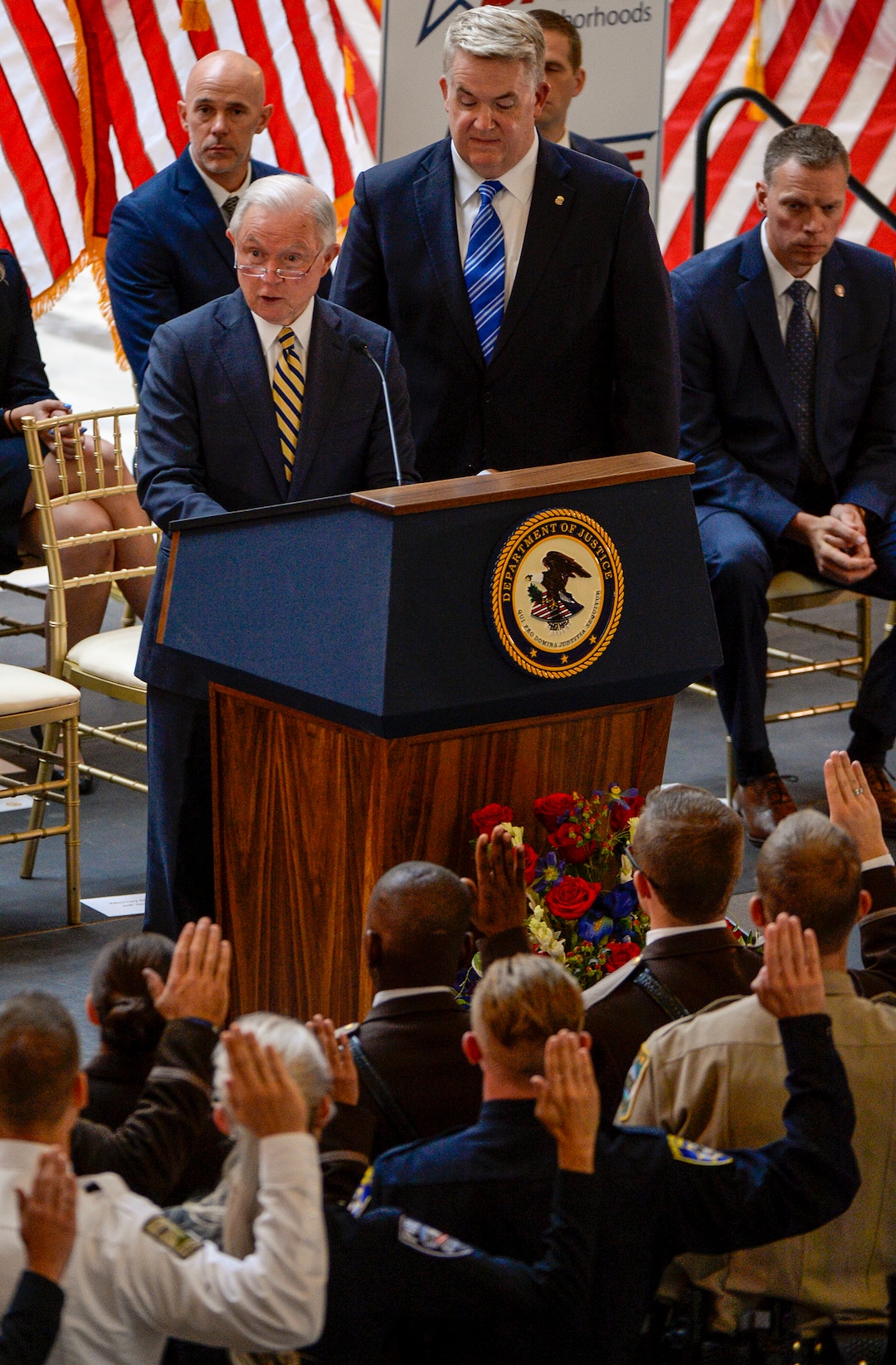 Leah Hogsten  |  The Salt Lake Tribune   U.S. Attorney General Jeff Sessions administers the oath to the Utah Post Academy members, October 3, 2018, at the Capitol.Wednesday marks the one year anniversary since the Trump administration returned to the Project Safe Neighborhoods policy pushed by the George W. Bush administration. Under Project Safe Neighborhoods, federal prosecutors focus on security stiff sentences for those convicted of gun crimes and reducing violent crimes.