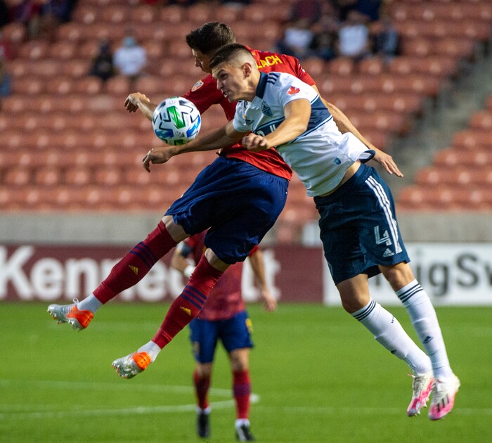 (Rick Egan  |  The Salt Lake Tribune) Real Salt Lake midfielder Damir Kreilach (8) and Vancouver Whitecaps defender Ranko Veselinovic (4) collide as they go for the ball, in MLS soccer action between Real Salt Lake and the Vancouver Whitecaps at Rio Tinto Stadium on Saturday, Sept. 19, 2020.

 