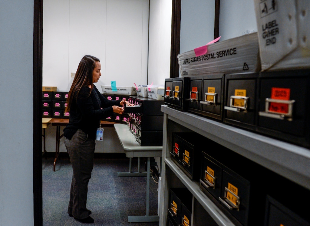 (Leah Hogsten  |  The Salt Lake Tribune)  “Monday’s are the worst,” said Utah Driver License Division records manager Britani Flores who receives on average three mail bins a day of returned driver licenses envelopes due to incorrect postal addresses. Each license is refiled in a filing cabinet until the correct postal address is updated on the division website, Tuesday, Oct. 1, 2019.  By October 2020 all driver licenses in the United States must have a gold star by order of the Department of Homeland Security. It shows officials have reviewed birth certificates or passports to ensure license holders are U.S. citizens.