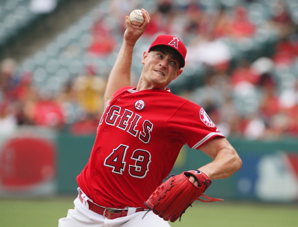 FILE - In this Sept. 17, 2017, file photo, Los Angeles Angels pitcher Garrett Richards works against the Texas Rangers in the first inning of a baseball game in Anaheim, Calif. Richards is not interested in dwelling on all the time he missed, all the countless hours of rehab, rather turning his attention to what he can do to help the Angels now that he's healthy at last. Last year, Richards had prepared to pitch for a full season after working his way back from a torn ulnar collateral ligament in his elbow for which he underwent stem cell therapy instead of having the more common Tommy John reconstructive surgery. Then he was hurt again in his season debut.  (AP Photo/Reed Saxon)