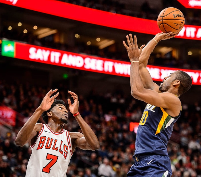 (Trent Nelson | The Salt Lake Tribune)  Utah Jazz guard Alec Burks (10) shoots over Chicago Bulls guard Justin Holiday (7) as the Utah Jazz host the Chicago Bulls, NBA basketball in Salt Lake City Wednesday November 22, 2017.