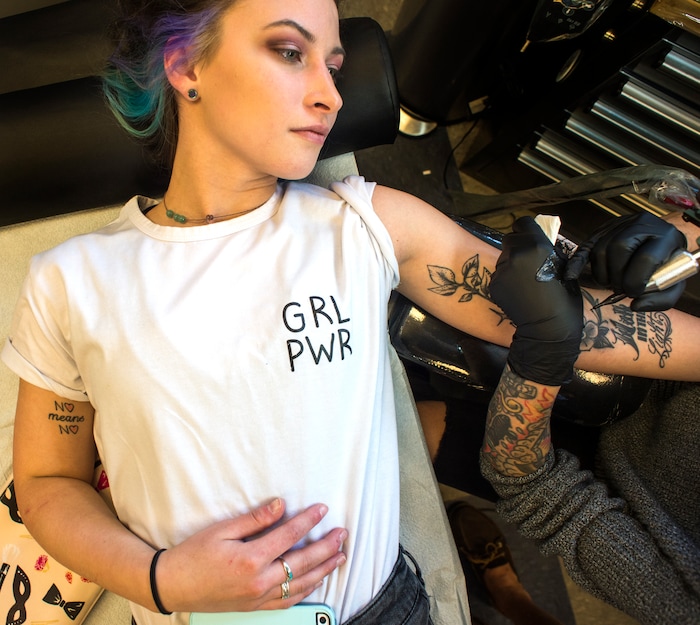 (Rick Egan | The Salt Lake Tribune) Nyx Porter gets a tattoo from Ashley Love, at the Yellow Rose Tattoo, during a flash tattoo event where all proceeds go to the Rape Recovery Center of Utah. It's part of a national event where tattoo shops raise money for sexual assault victims. Sunday, June 10, 2018.