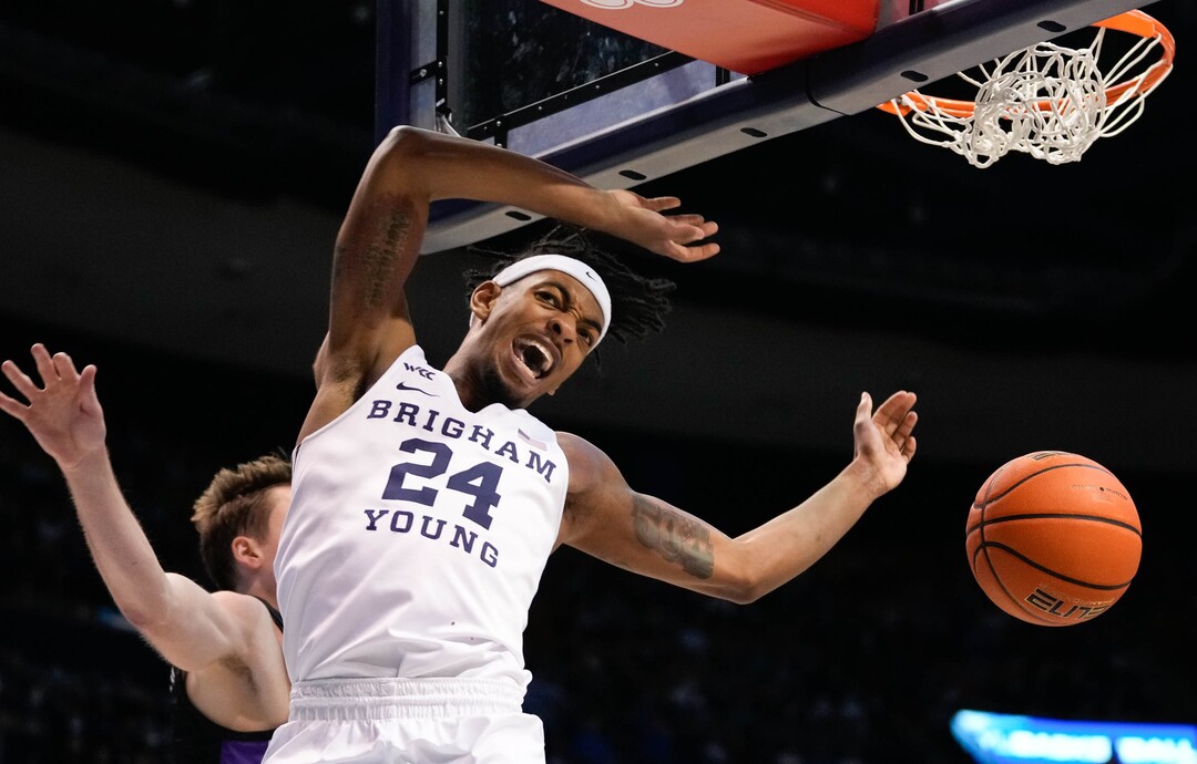 (Francisco Kjolseth | The Salt Lake Tribune) Brigham Young Cougars forward Seneca Knight (24) celebrates a dunk in the final minutes in WCC basketball action between the Brigham Young Cougars and the Portland Pilots, at the Marriott Center, on Saturday, January 22, 2022.