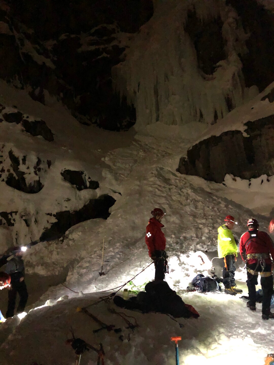 (Photo courtesy of the Utah County Sheriff's Office) Rescuers help a dog that  fell into a 40-foot snow cavern at Stewart Falls near Sundance Ski Resort. The dog, Beeroo, fell through a hole in the ceiling on Saturday, Feb. 2.