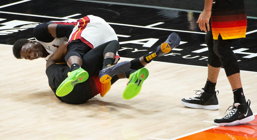 (Francisco Kjolseth  | The Salt Lake Tribune) Utah Jazz guard Miye Oni (81) tumbles with Miami Heat center Bam Adebayo (13) as the Utah Jazz take on the Miami Heat at Vivint Smart Home Arena in Salt Lake City, on Saturday, Feb. 13, 2021.