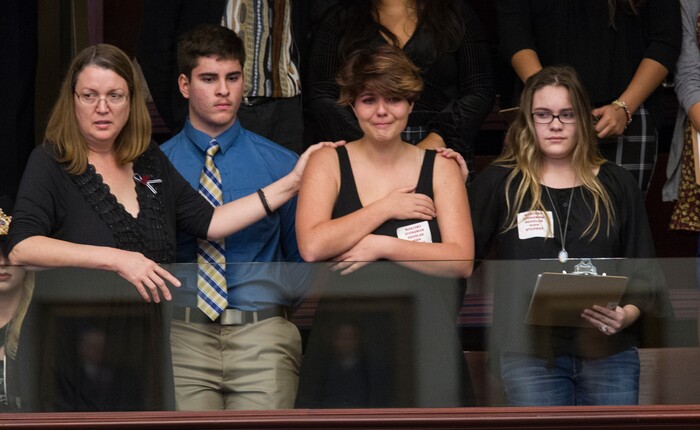 Sheryl Acquarola, a 16 year-old junior from Marjory Stoneman Douglas High School is overcome with emotion in the east gallery of the House of Representatives after the representatives voted not to hear the bill banning assault rifles and large capacity magazines at the Florida Capital in Tallahassee, Fla., Tuesday, Feb 20, 2018. Acquarola was one of the survivors of the Marjory Stoneman Douglas High School shooting that left 17 dead, who were in Tallahassee channeling their anger and sadness into action. (AP Photo/Mark Wallheiser)
