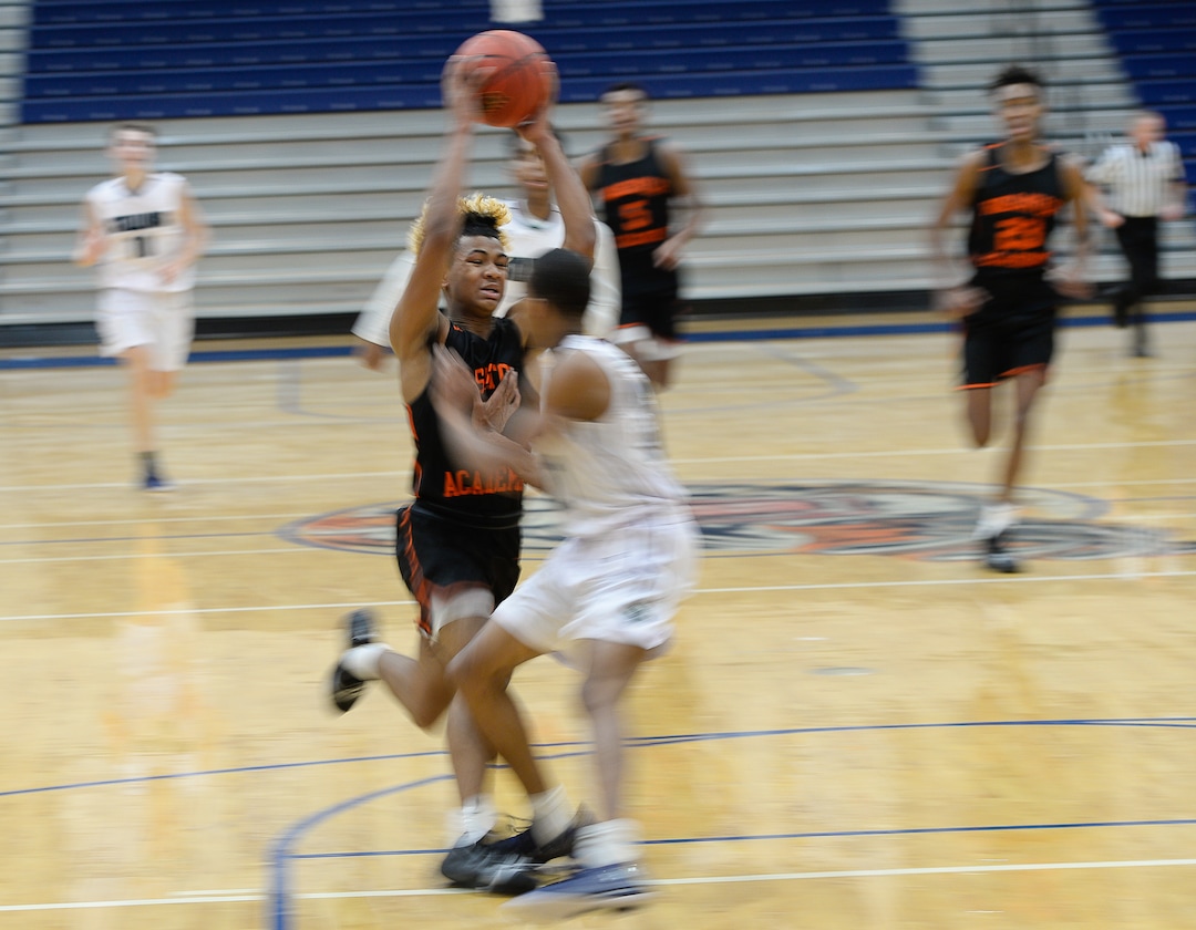 (Francisco Kjolseth  |  The Salt Lake Tribune)  Mike Saunders of Wasatch Academy tries to push past the South County High defense during a recent tournament game at Orem High School. 