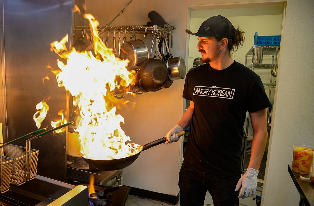 (Francisco Kjolseth  |  The Salt Lake Tribune)  Sous chef Nick Wankier, fires up an order of Japchae, Korean sweet potato noodles with an assortment of vegetables at the Angry Korean fusion restaurant in South Jordan.