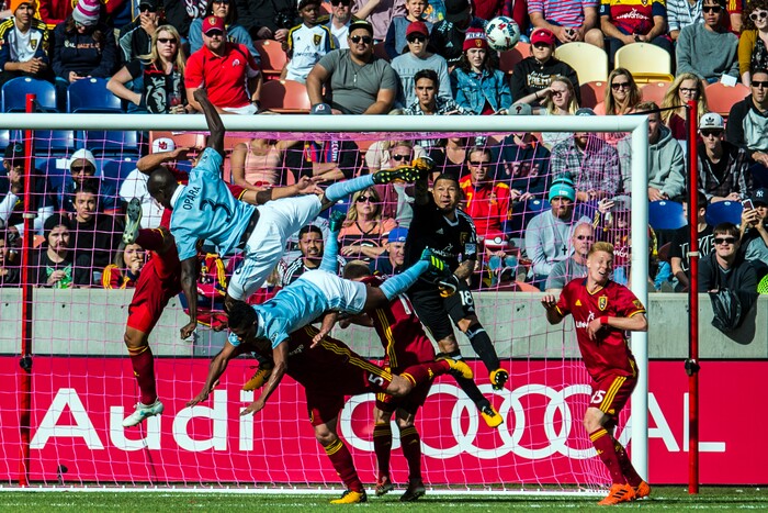 (Chris Detrick  |  The Salt Lake Tribune)  Real Salt Lake goalkeeper Nick Rimando (18) makes a save against Sporting Kansas City defender Ike Opara (3) and Sporting Kansas City forward Latif Blessing (9) during the game at Rio Tinto Stadium Sunday, October 22, 2017.  