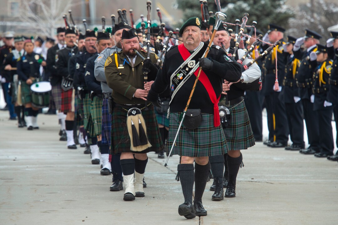 (Rick Egan  |  The Salt Lake Tribune)     The Utah Firefighters Emerald Society Pipe Bands lead the procession at the Maverik Center, after the funeral for South Salt Lake police officer, David Romrell, who died after being struck by a car during a clash with two burglary suspects on Nov. 24. Wednesday, Dec. 5, 2018.