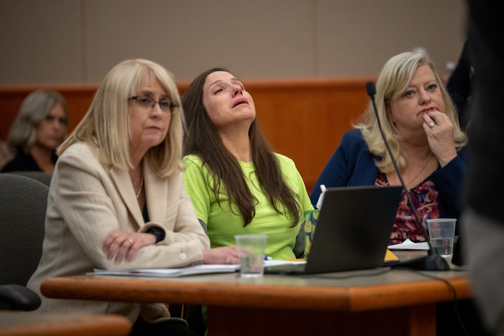 (Trent Nelson  |  The Salt Lake Tribune) Kouri Richins reacts as her brother, Ronney Darden, speaks on her behalf during her sentencing in 3rd District Court in Park City on May 13, 2026.  At left is defense attorney Wendy Lewis and at right is defense attorney Kathy Nester.