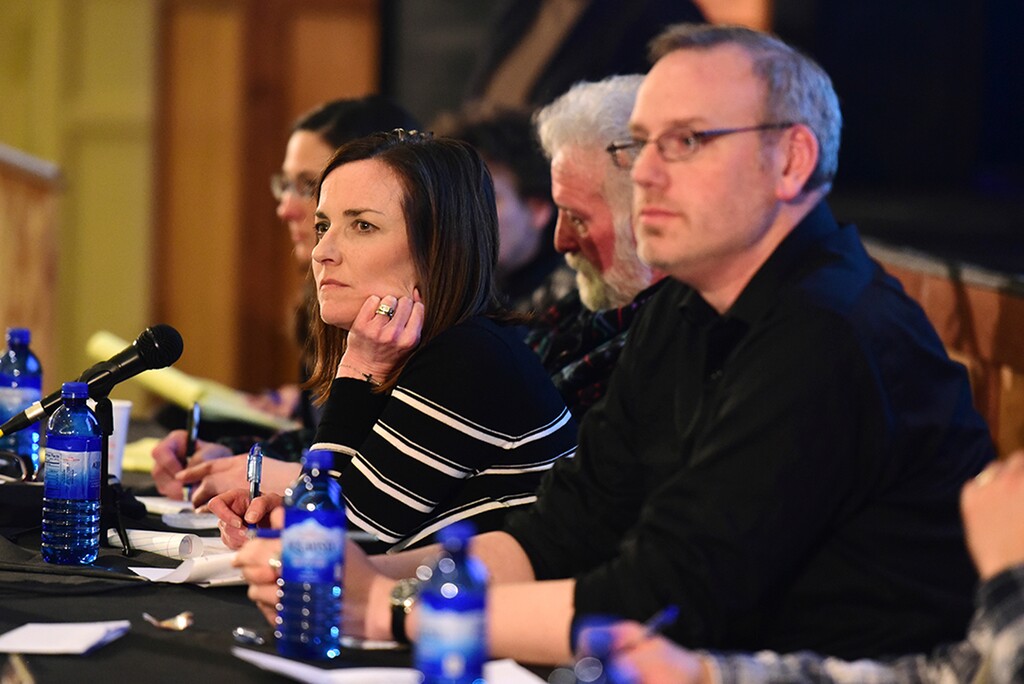 In this Jan. 8, 2018 photo, Park County School District 6 board chair Kelly Simone, center, listens to members of the community voice their opinions on Policy CKA, which would allow armed personnel in schools, during a public forum about the policy in Cody, Wyo. The Wyoming school district where the U.S. education secretary famously suggested teachers might need to carry guns to protect children from grizzly bears is about to vote whether to do just that. The Park County School District No. 6 board votes Tuesday, April 17, 2018, on allowing trained school employees to carry concealed firearms. (Rebecca Noble/The Cody Enterprise via AP)