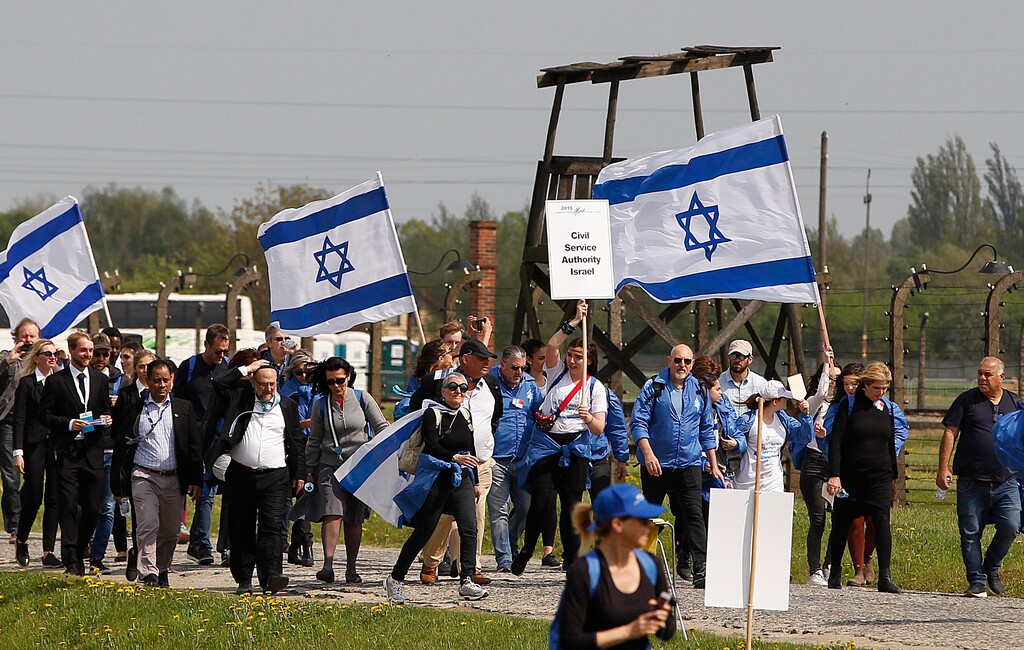 (Czarek Sokolowski | AP file photo) Young Jews from around the world walk with Israeli flags through the former Nazi German death camp of Auschwitz-Birkenau during the annual Holocaust remembrance event, the "March of the Living" in memory of the six million Holocaust victims in Oswiecim, Poland, Thursday, May 2, 2019.