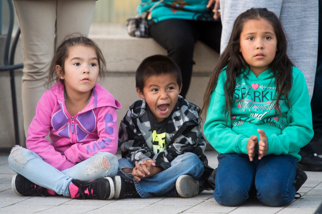 (Rick Egan  |  The Salt Lake Tribune)  Left to right - Jacqueline Livingston, Achilles Russell and Assyria Russell, watch the dancers, during the Indigenous Peoples Day celebration, hosted by the Utah League of Native American Voters and PANDOS (Peaceful Advocates for Native Dialogue and Organizing Support) at the Salt Lake City Library, Monday, October 9, 2017.
