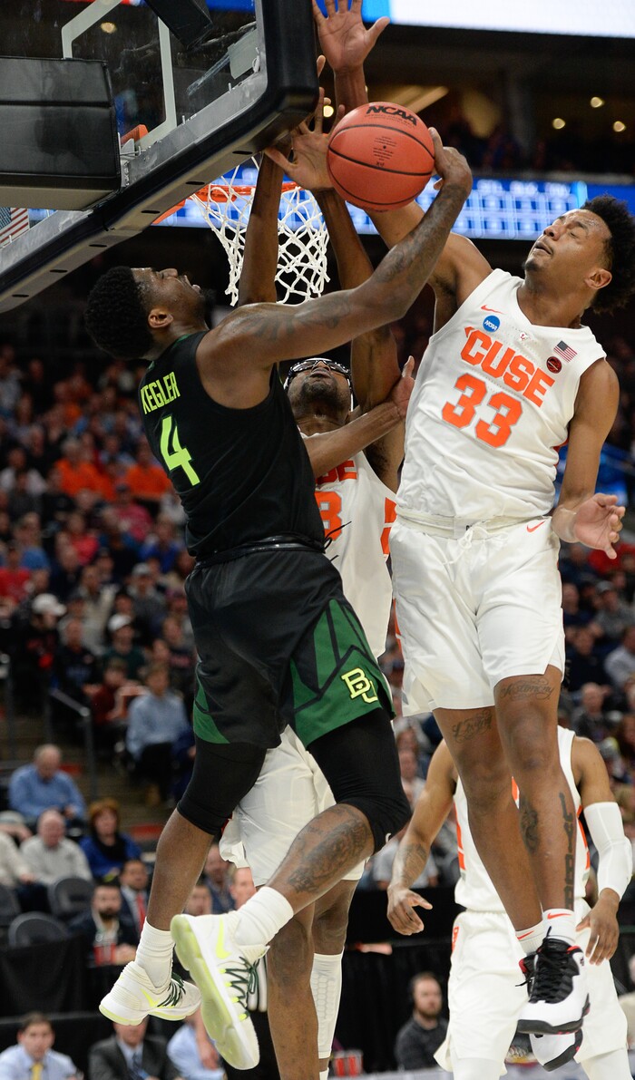(Francisco Kjolseth  |  The Salt Lake Tribune)  Baylor Bears guard Mario Kegler (4) tries to get one past Syracuse Orange forward Elijah Hughes (33) as Syracuse faces Baylor in their first round menÕs NCAA March Madness tournament game at Vivint Smart Home Arena in Salt Lake City on Thursday, March 21, 2019.