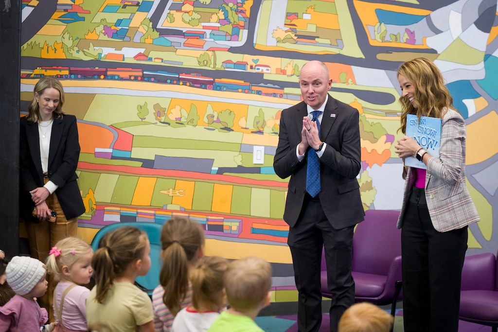 (Bethany Baker | The Salt Lake Tribune) Gov. Spencer Cox speaks to children after first lady Abby Cox read to them at the Kearns Library in December. The governor is calling for a bell-to-bell ban on cellphones in school.