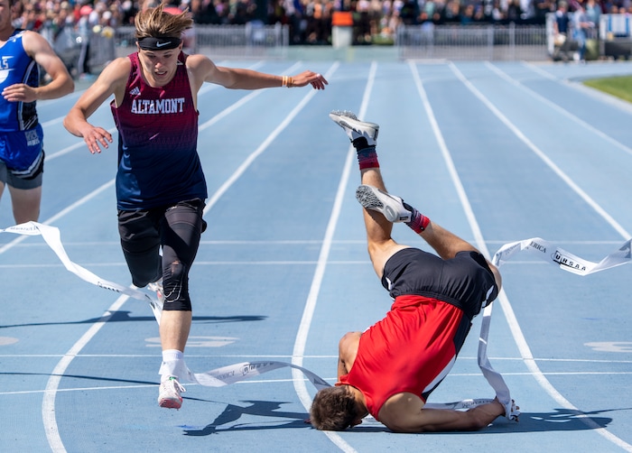 (Rick Egan | The Salt Lake Tribune)  Altamont's Ethan Hansen finishes in second place as Blake Barnes dives headfirst into the finish line for a first place finish in the 1A Boys 200 meter dash, at the State High School Championships at BYU, on Saturday, May 21, 2022.
