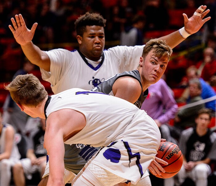 (Trent Nelson | The Salt Lake Tribune)  Box Elder vs. Corner Canyon, 5A State high school basketball tournament at the Huntsman Center in Salt Lake City, Wednesday Feb. 28, 2018. Corner Canyon's Gabe Toombs (32) defended by Box Elder's Tyson Madson (15).